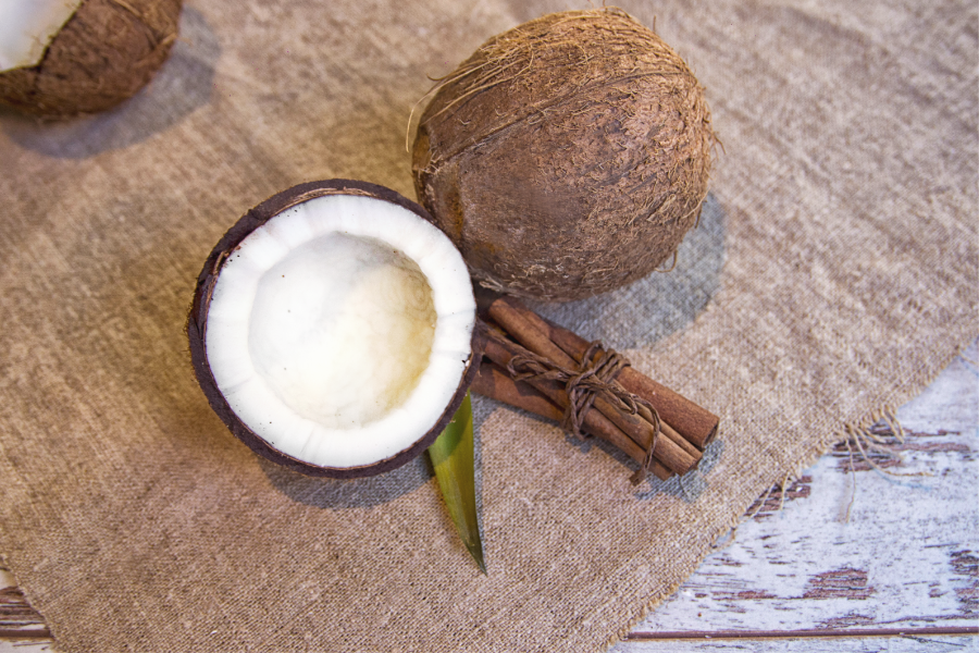 coconuts and cinnamon on a surface